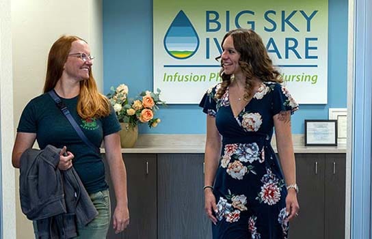 Client & staff member walking down the hall