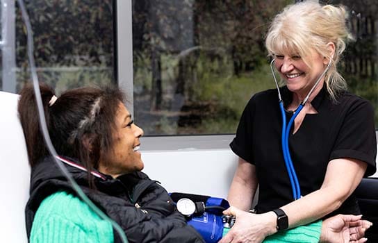 Nurse helping a medical infusion patient