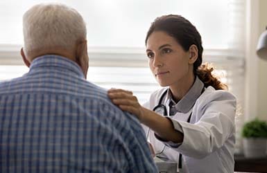 Caring nurse with patient