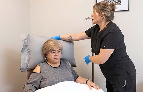 Patient being helped to be more comfortable